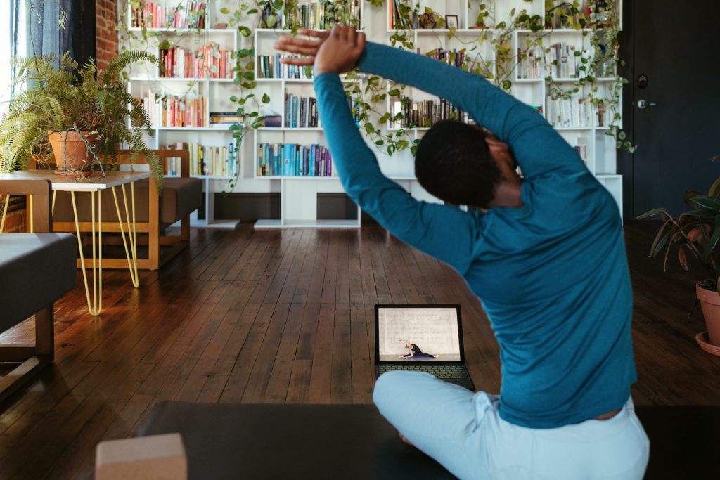 a man doing yoga in a living room